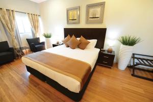 Uma cama ou camas num quarto em Timor Plaza Hotel & Apartments