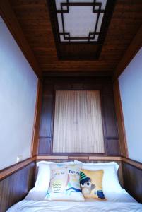 Postel nebo postele na pokoji v ubytování 君彤景園 餐飲住宿