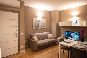 A television and/or entertainment centre at Sirmio Apartments - Narnia Stay