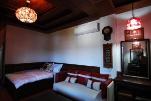 Postel nebo postele na pokoji v ubytování 君彤景園 餐飲住宿