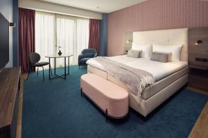 Postel nebo postele na pokoji v ubytování Van der Valk Hotel Haarlem