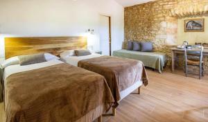 Posteľ alebo postele v izbe v ubytovaní MASÍA CAN GRAU habitaciones con desayuno inlcuido