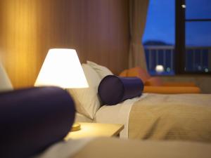 Letto o letti in una camera di Kichimu