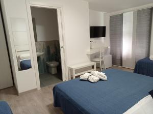 Łóżko lub łóżka w pokoju w obiekcie Bouganville da Giò