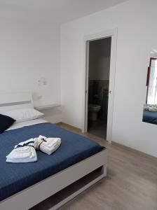 Łóżko lub łóżka w pokoju w obiekcie Bouganville da Giò