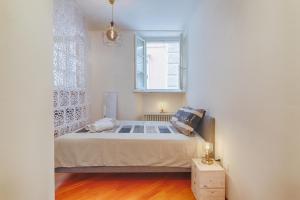 Ένα ή περισσότερα κρεβάτια σε δωμάτιο στο Il Rifugio del Principe-ampio monolocale in centro