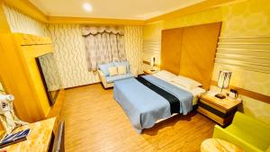 Postel nebo postele na pokoji v ubytování Dong Zhi Gang Motel