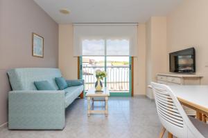TV a/nebo společenská místnost v ubytování Duerming Velero Apartamentos