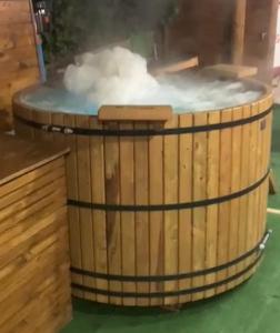 a hot tub filled with white steam at Cabañas Kimaya El Quisco in El Quisco