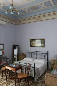 Ένα ή περισσότερα κρεβάτια σε δωμάτιο στο Villa Genny