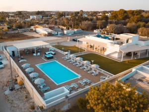 an aerial view of a house with a swimming pool at La Palazzina Bed & Breakfast in Porto Cesareo