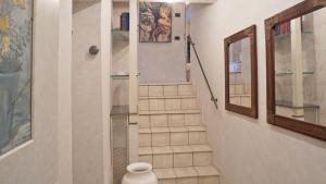 a bathroom with a staircase with a shower and a mirror at Cala D'Oria in Lerici +27 photos