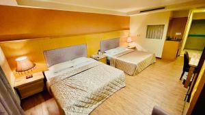 Postel nebo postele na pokoji v ubytování Dong Zhi Gang Motel