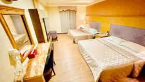 Postel nebo postele na pokoji v ubytování Dong Zhi Gang Motel