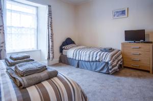 Foto da galeria de Dragons Den - 2 Bedroom Apartment - Tenby em Tenby