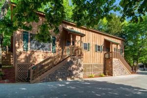 a building with a staircase in front of it at Cabins at Green Mountain, Trademark Collection by Wyndham in Branson