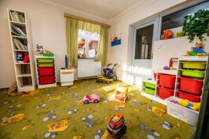 a childs room with toys on the floor at penzion Vysoká Stráž in Pec pod Sněžkou