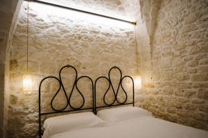 Een bed of bedden in een kamer bij Casa Sotto l'Arco