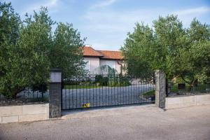 a gate in front of a house at Villa Aleksandra in Ljubuški