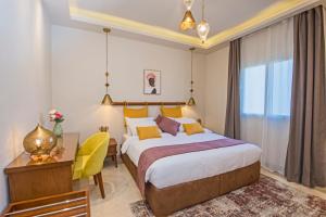 מיטה או מיטות בחדר ב-OSKENA Azzurra Sahl Hasheesh Hurghada