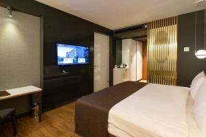 Postel nebo postele na pokoji v ubytování The Craton Hotel Sisli