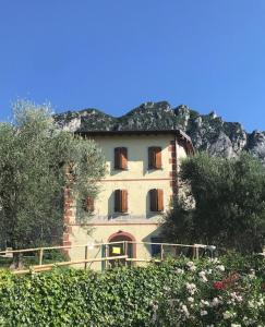 a house on the side of a mountain at Chicco di Senape in Gargnano