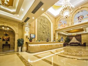 a large lobby with a chandelier and a large room at Vienna International Hotel Donglin Road in Nanjing