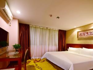Katil atau katil-katil dalam bilik di Vienna Hotel Shenzhen Railway station +8 gambar