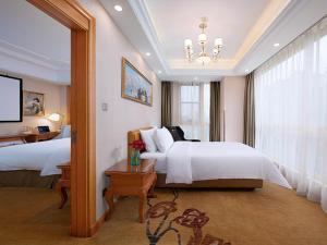 Katil atau katil-katil dalam bilik di Vienna Hotel(Rugao Auto Station Branch)
