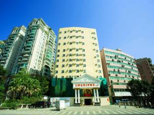 a tall building with a pagoda in front of it at Vienna 3 Best Hotel Guangzhou Guangzhou Tower in Guangzhou