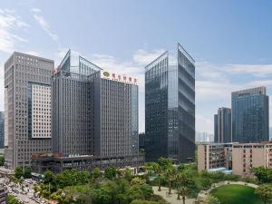 a group of tall buildings in a city at Vienna Hotel Guiyang Exhibition Center in Guiyang