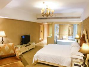 Ένα ή περισσότερα κρεβάτια σε δωμάτιο στο Vienna Hotel Yongzhou Zhiyuan New Bund