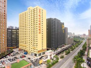 an overhead view of a large yellow building in a city at Vienna Hotel Shenzhen Bantian South Huancheng Road in Shenzhen