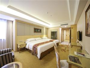Ένα ή περισσότερα κρεβάτια σε δωμάτιο στο Vienna Hotel Shanghai Hongqiao Convention & Exhibition Center +18 φωτογραφίες