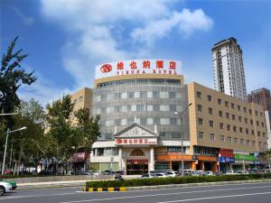 a building with a sign on top of it at Vienna Hotel Hefei East Changjiang Road in Hefei