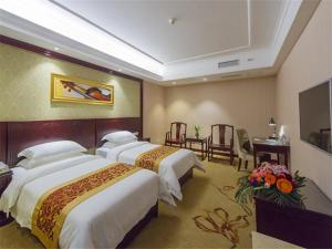 Postel nebo postele na pokoji v ubytování Vienna Hotel Guilin North Road