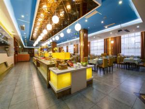Restoran ili drugo mesto za obedovanje u objektu Vienna Hotel Qinzhou North Area Plaza