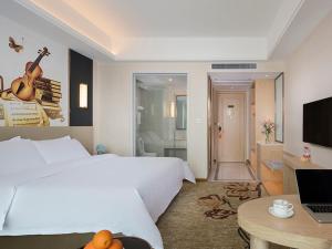 TV a/nebo společenská místnost v ubytování Vienna International Hotel (Changsha Ningxiang South Bus Station) + 10 fotografií