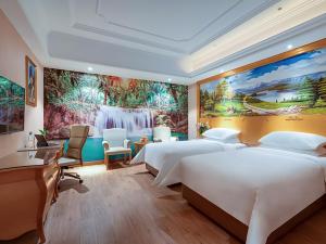a bedroom with two beds and a painting on the wall at Vienna Hotel(Shanghai Chongming Lvhai Road.) in Shanghai