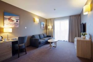 TV a/nebo společenská místnost v ubytování Tristan Hotel & SPA