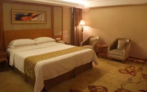 Ένα ή περισσότερα κρεβάτια σε δωμάτιο στο Vienna Hotel Shanwei Chengqu Xingye Road +3 φωτογραφίες