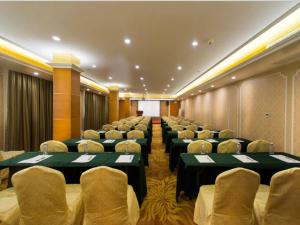 a large conference room with chairs and tables in it at Vienna Hotel Guangzhou Songnan in Guangzhou