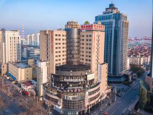 an aerial view of a city with tall buildings at Vienna Hotel Shanghai Baoshan Wusong in Shanghai