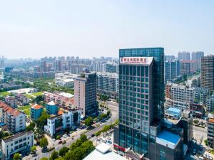 an aerial view of a city with tall buildings at Vienna Hotel Kunshan North Qingyang Road in Kunshan