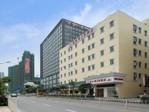 a building on the side of a city street at Vienna 3 Best Hotel Shenzhen South University of Science and Technology of China in Shenzhen