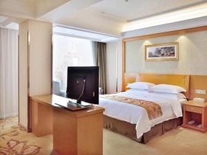 Un ou plusieurs lits dans un hébergement de l'établissement Vienna Hotel Hefei East Changjiang Road