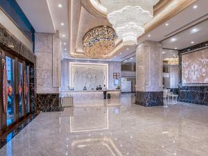 Area lobi atau resepsionis di Vienna International Hotel Guangdong Zhongshanbei Station