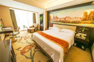 Ένα ή περισσότερα κρεβάτια σε δωμάτιο στο Vienna Hotel Zhumadian Huayuan Xuefu +4 φωτογραφίες