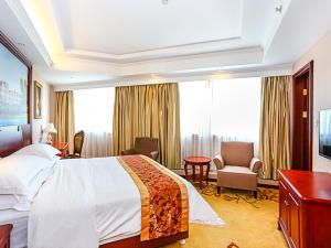 Postel nebo postele na pokoji v ubytování Vienna International Hotel Shanghai Fengxian Nanqiao
