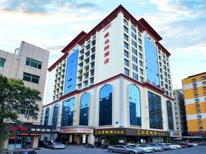 a large white building with chinese writing on it at Vienna Classic Hotel Shenzhen Bantian Wuhe Avenue in Shenzhen